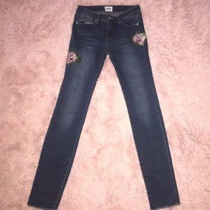 Dark Hudson jeans with flower embroidery.